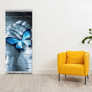 Deursticker - Blauwe vlinder aan de muur (3)